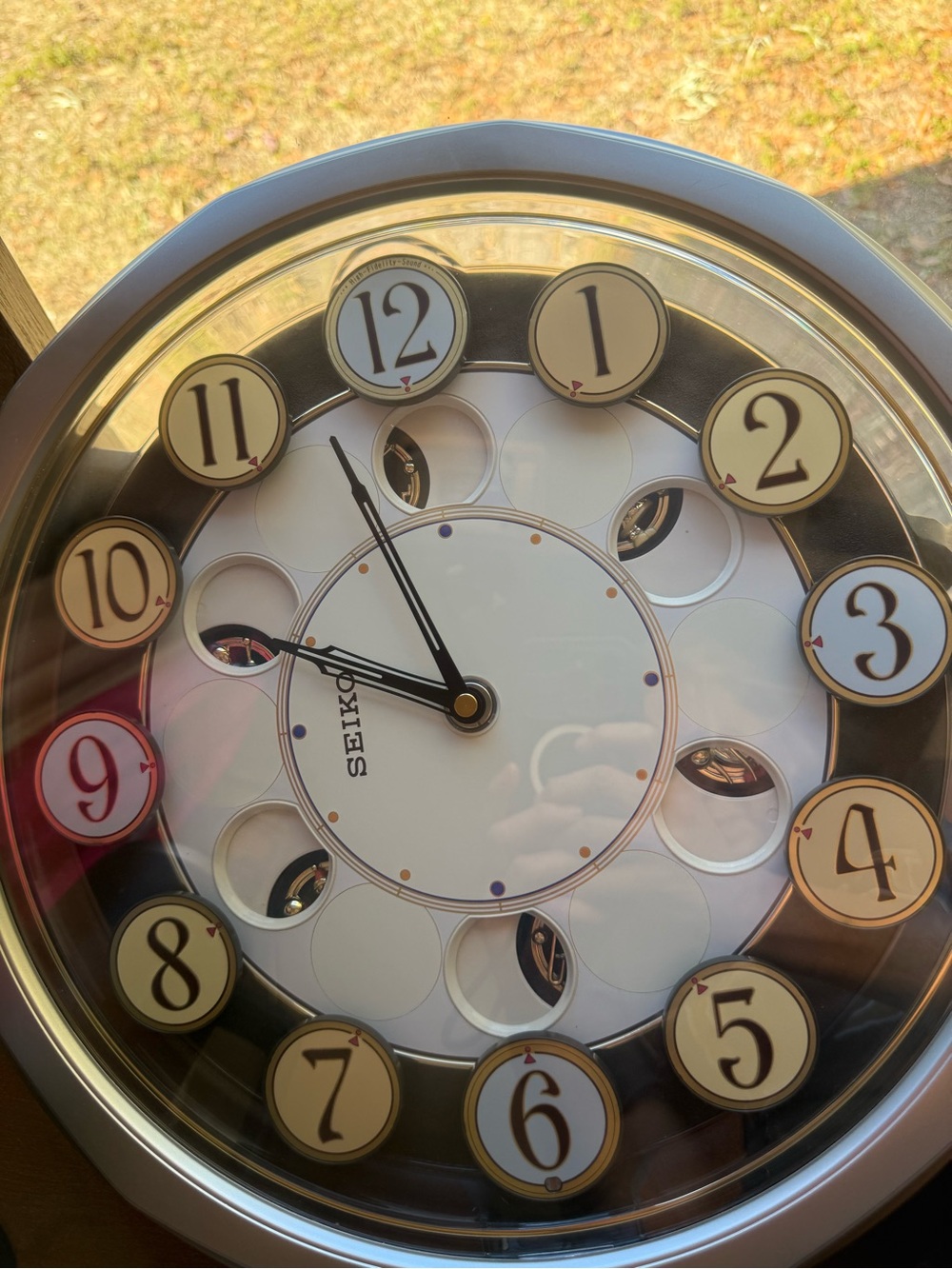 Seiko QXM106SRH "Twirling Numbers" Melodies in Motion wall clock